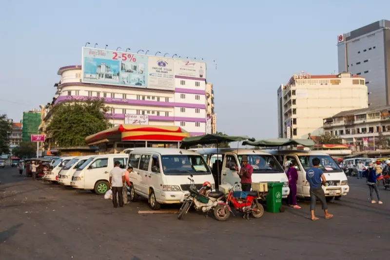 Minivans waiting for passengers next to the Central Market in Phnom Penh