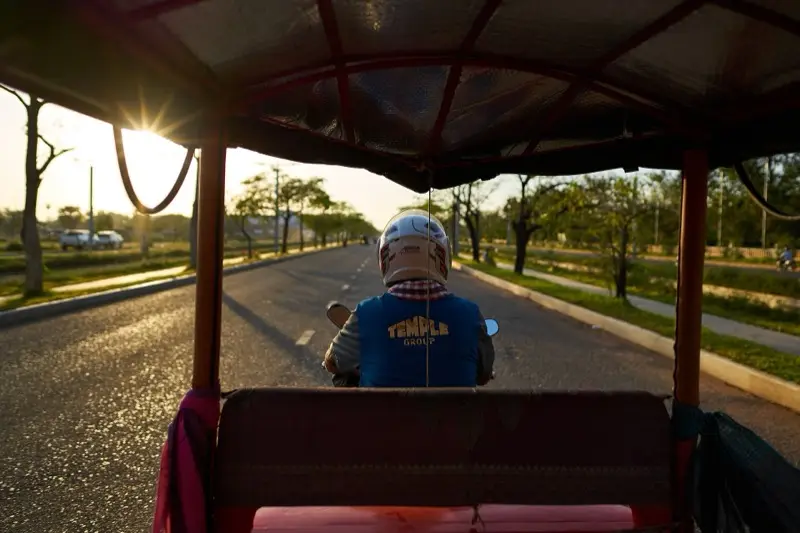 Riding in a Cambodian tuk-tuk at golden hour